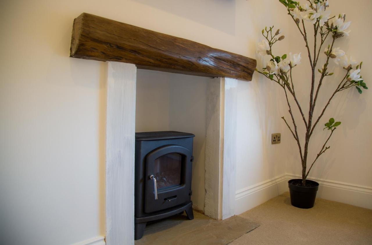Winckley Stays Preston  Extérieur photo A fireplace with a log burning stove